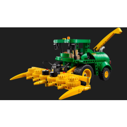 Side view of a green and yellow John Deere 9700 Forage Harvester LEGO Technic model with a large front forage header.