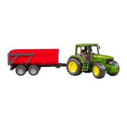Side view of a green John Deere tractor with yellow wheels attached to a red dump trailer.