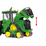 Front-side view of a green John Deere tracked tractor model with yellow rollers and an open hood revealing engine details.