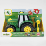 Side view of a green and yellow John Deere Build A Johnny Tractor toy in its box with an assembly tool.